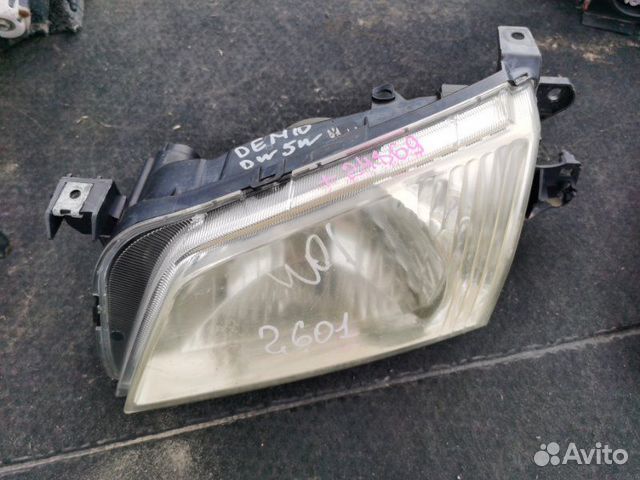 Фара левая Mazda Demio DW