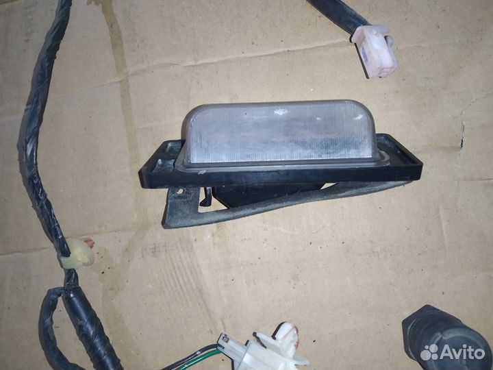 Фонарь подсветки номера Mitsubishi Galant 8
