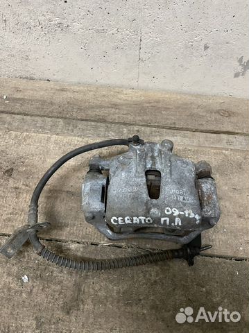 Суппорт тормозной передний левый Kia Cerato