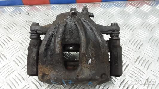 Суппорт тормозной передний левый toyota corolla ve