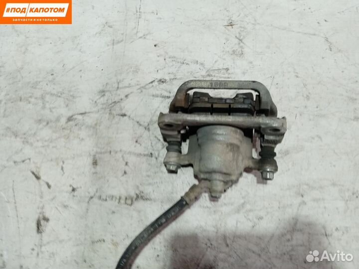 Суппорт тормозной задний левый Nissan Teana J32