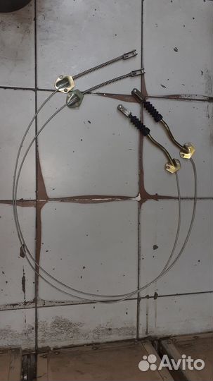 Трос стояночногно тормоза Волга газ24