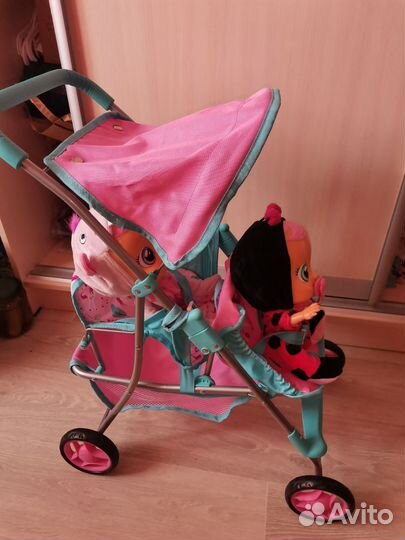 Коляска кукольная с пупсами