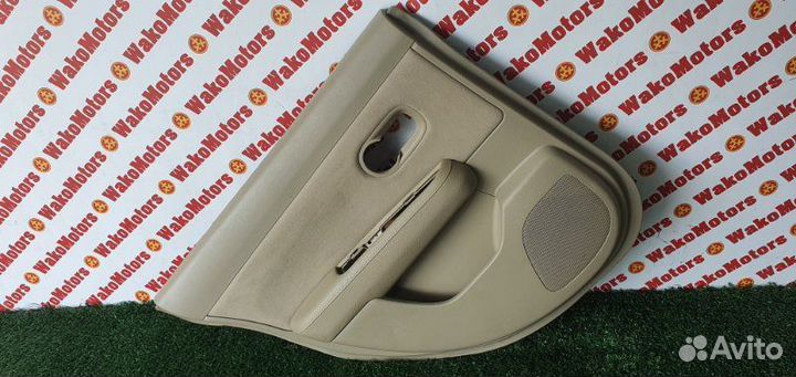 Обшивка боковой двери задняя левая Nissan Tiida