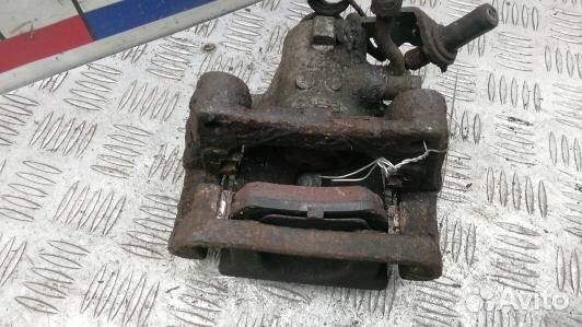 Суппорт тормозной задний левый KIA venga 1 (1SK45L