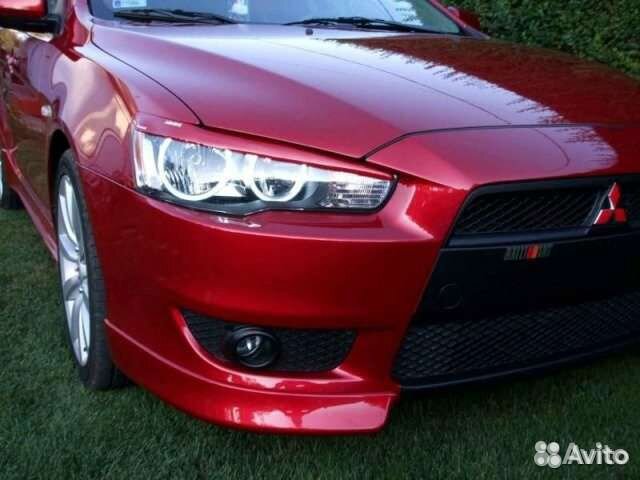 Клыки бампера Lancer X оригинал черный цвет