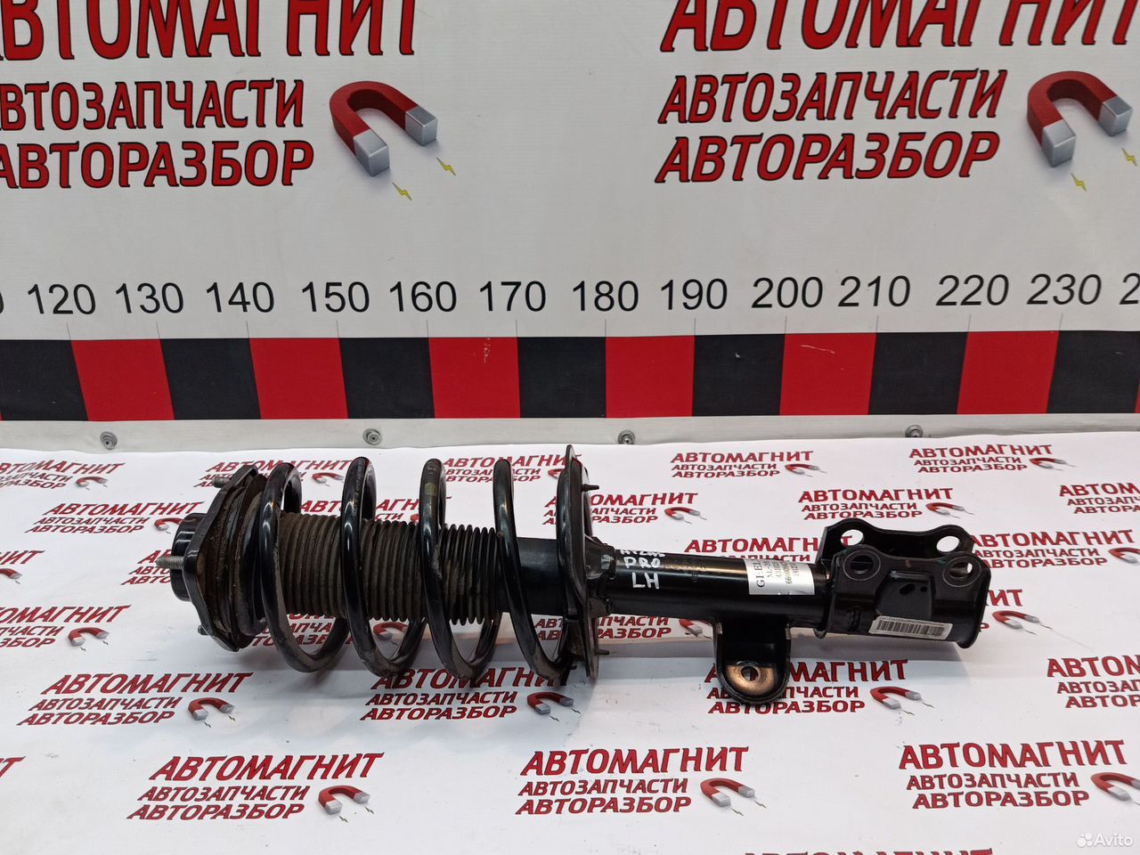 Стойка амортизатор передний левый Джили Атлас Про