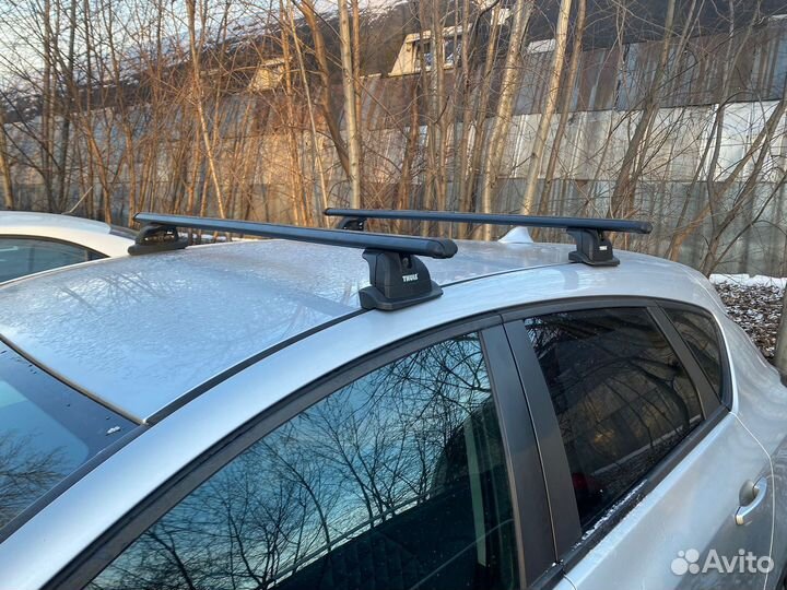 Багажник на крышу Opel astra j thule