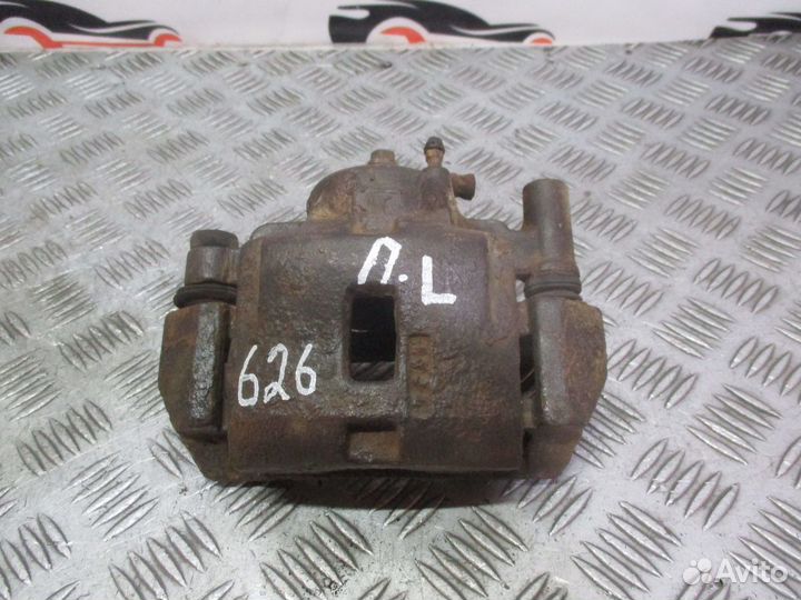 Суппорт тормозной передний Mazda 626 GF 1997-2002