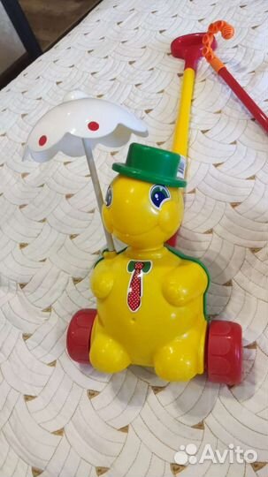 Игрушка каталка с ручкой