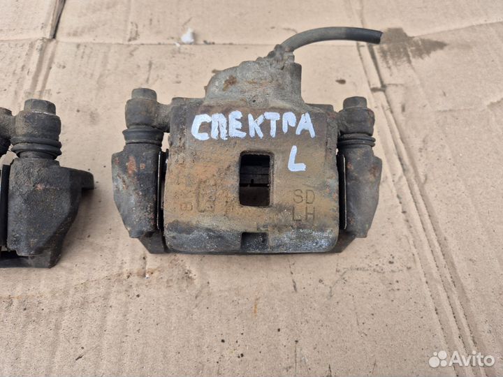 Суппорт передний Kia Spectra