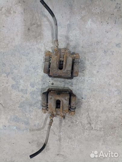 Суппорт тормозной задний Toyota Corolla 120 01-06г