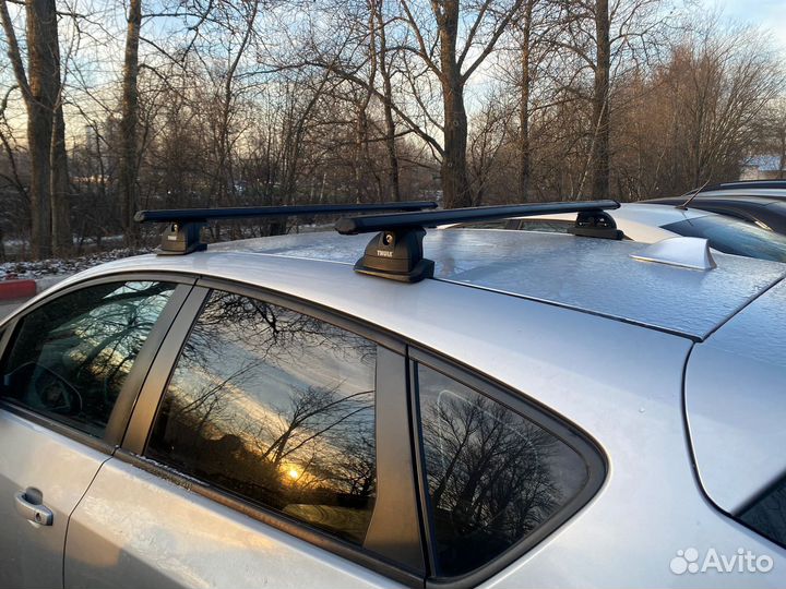 Багажник на крышу Opel astra j thule