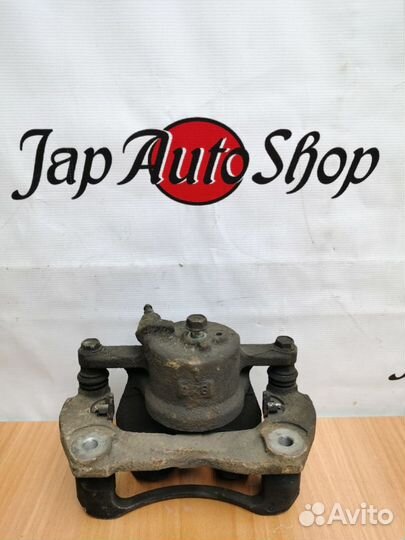 Суппорт передний левый Toyota Corolla 150