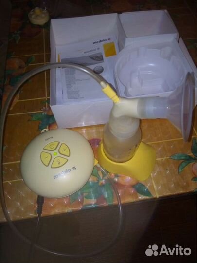 Молокоотсос электронный medela swing