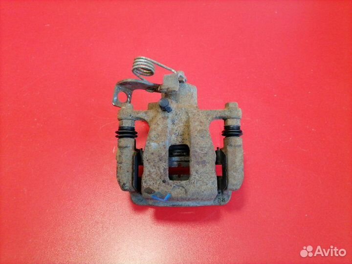 Суппорт задний левый Hyundai Solaris RB G4FC 2012