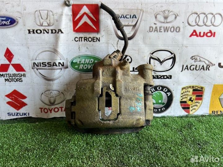 Суппорт тормозной передний левый Ford Escort 5