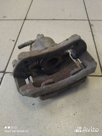 Суппорт тормозной передний левый Chevrolet Cruze