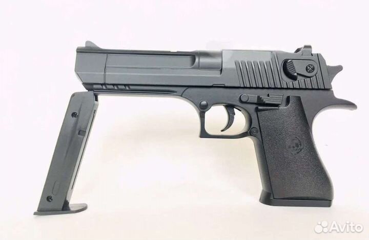 Детская игрушка пистолет