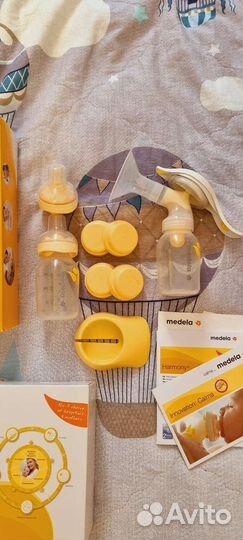 Молокоотсос medela + calma+ пакеты для молока