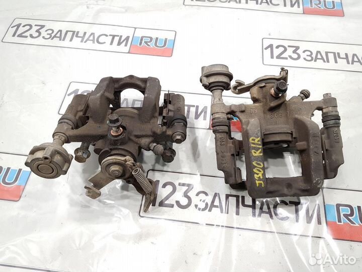 Суппорт тормозной задний левый Chevrolet Cruze