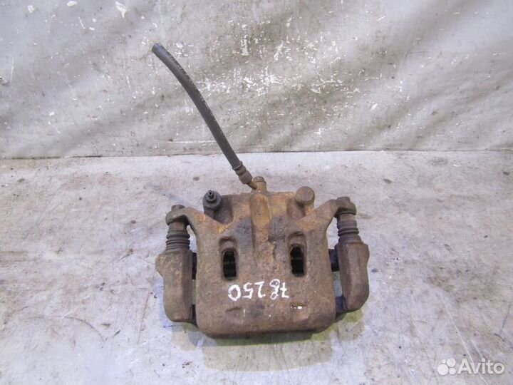 Суппорт передний левый Nissan Navara (D40) 2005-2