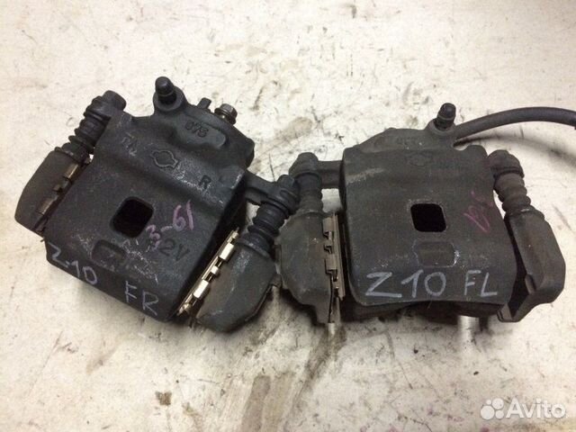 Суппорт передний правый Nissan Cube Z10 CG13DE