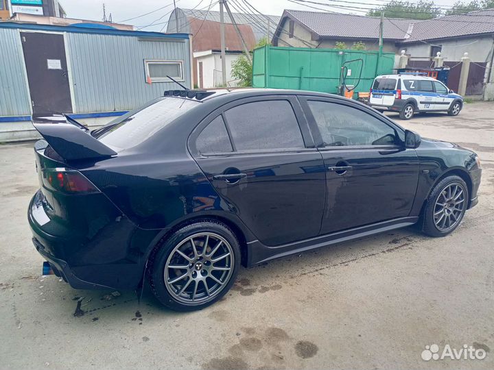 Задний бампер lancer 10 с эво накладкой