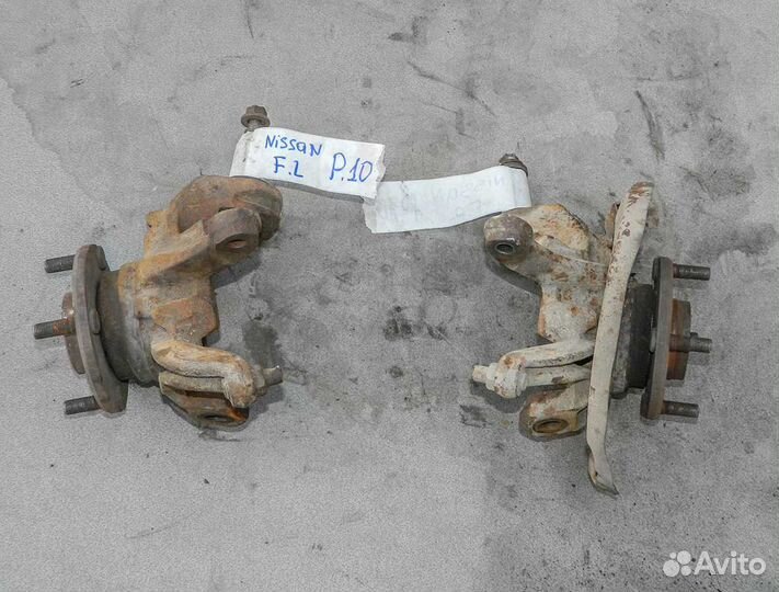 Кулак поворотный левый Nissan Primera P10