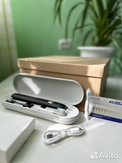 Электрическая зубная щетка