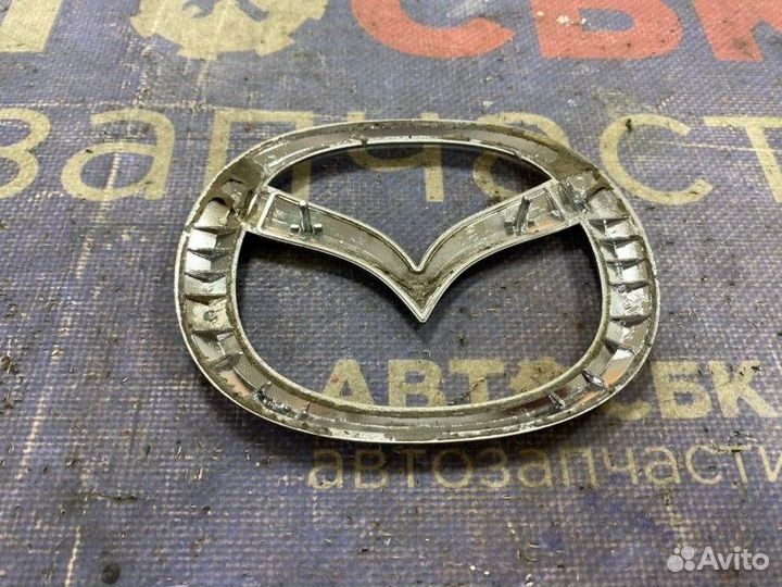 Эмблема задняя Mazda Axela BK L3VE 2003-2009
