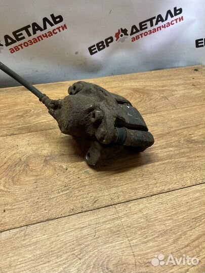 Суппорт тормозной передний левый Logan