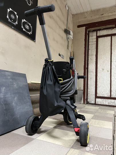Детский велосипед с ручкой doona