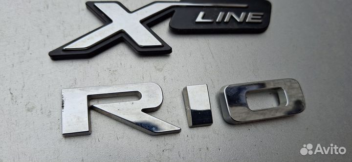 Эмблема задняя Rio x-line