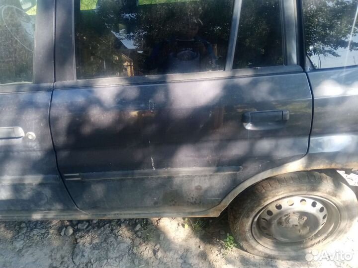 Двери mazda демио