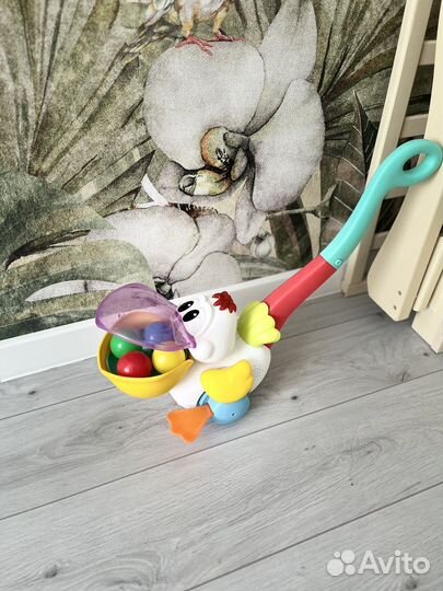 Игрушка каталка с ручкой