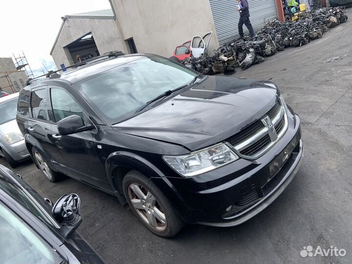 Суппорт тормозной задний левый dodge journey 2010