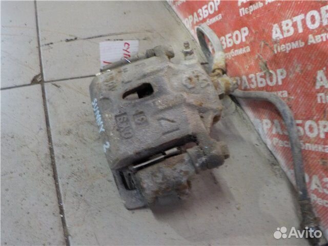 Суппорт передний правый Nissan Sunny traveller