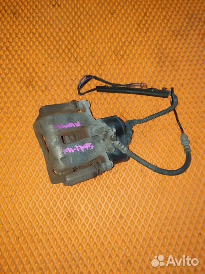 Суппорт тормозной задний левый Volkswagen Tiguan