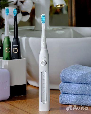 Электрическая зубная щетка