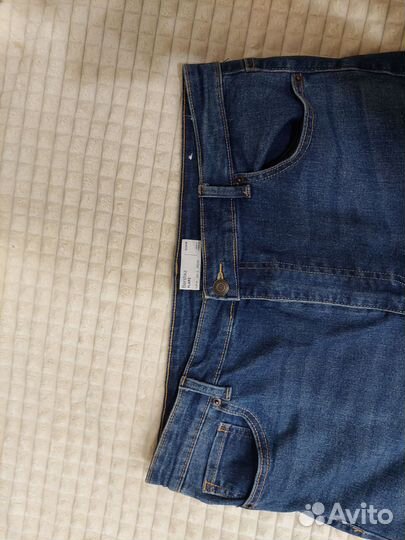 Джинсы клеш от колена