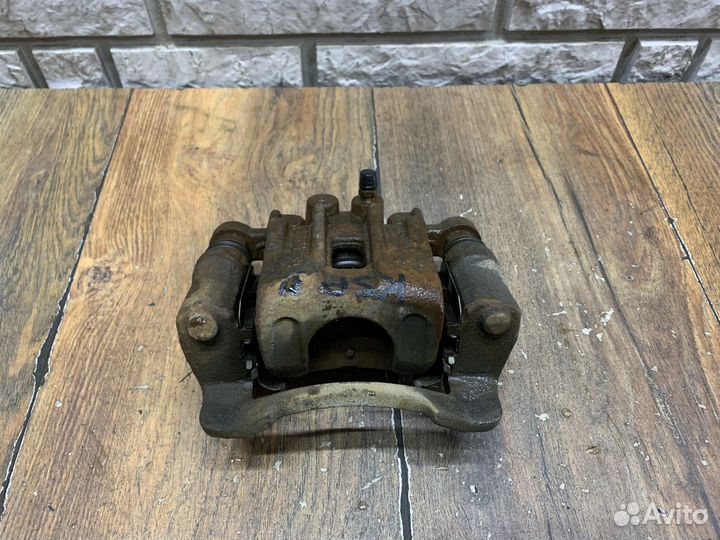 Kia Sportage Суппорт тормозной задний LH RH