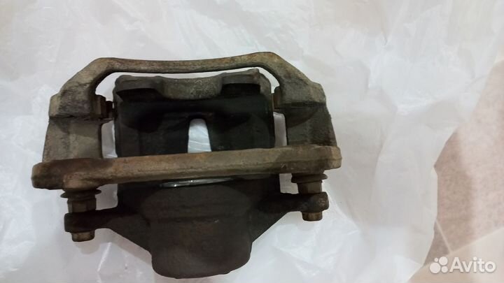 Суппорт тормозной передний левый kia cerato TD 2