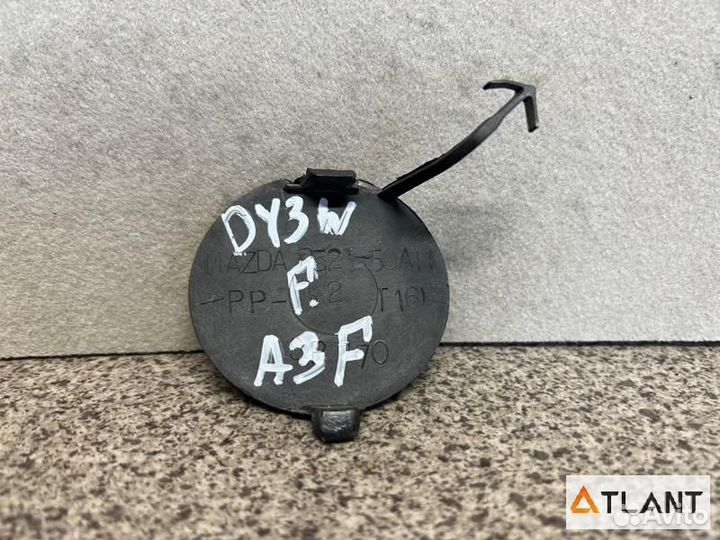 Заглушка бампера передняя mazda demio