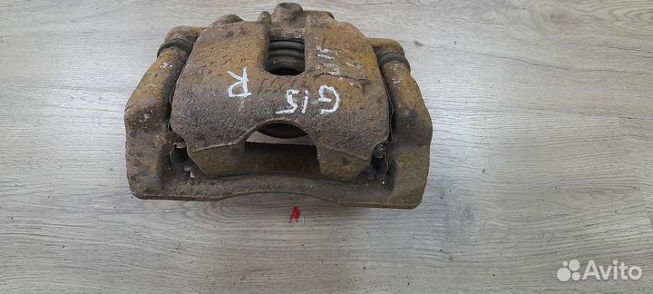 Суппорт передний правый Nissan Almera G15