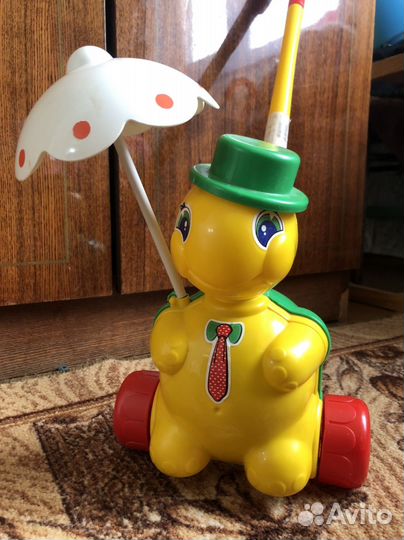 Игрушка каталка с ручкой