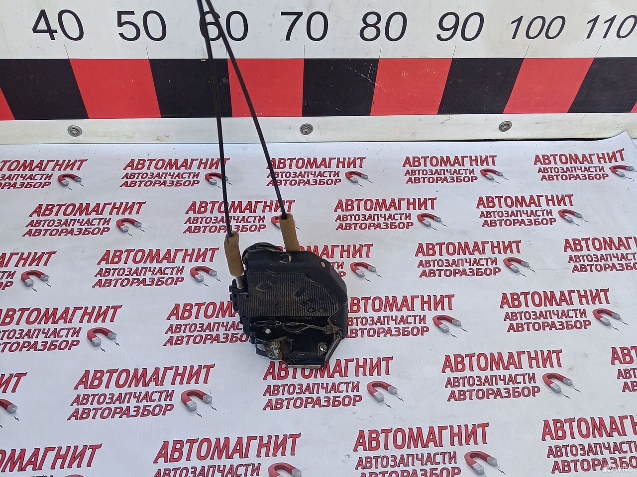 Замок двери задний левый Тойота Королла Е150