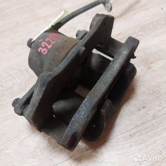 Суппорт тормозной передний левый Suzuki Grand