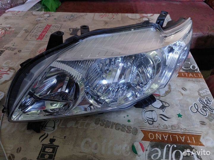 Фара левая toyota corolla 150