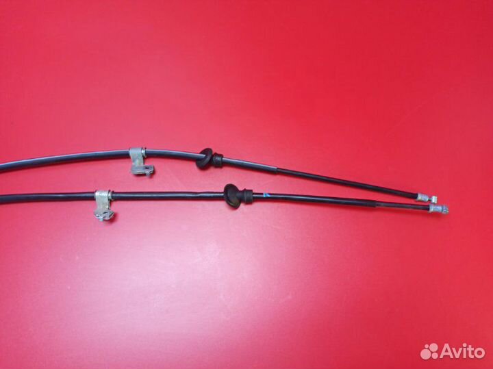 Трос стояночного тормоза задний Mitsubishi Lancer